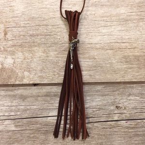 Pistol with tear drop pendant suede tassel